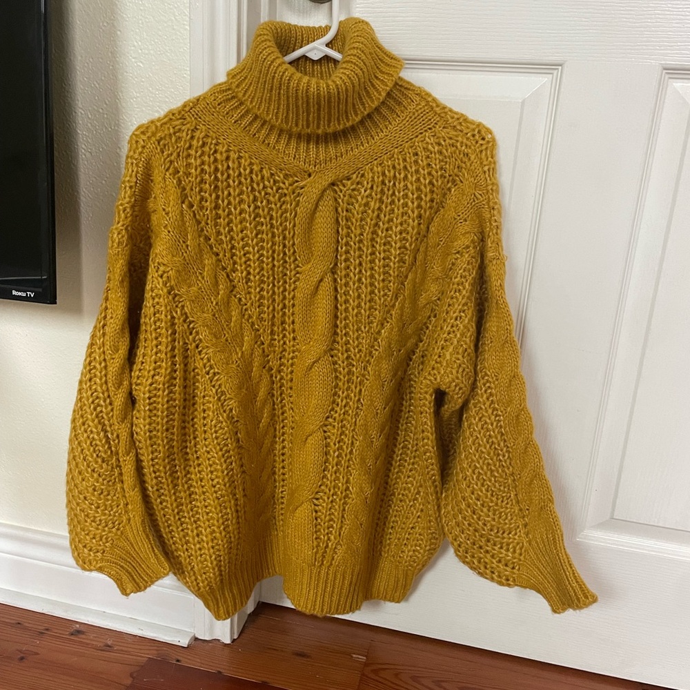 Yellow turtleneck cable knit sweater